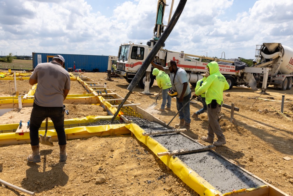 Concrete beams being poured for the foundation of Fire Station #2