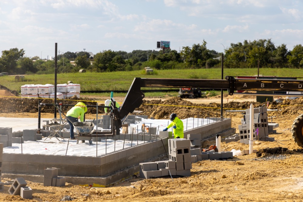 Workers building the CMU block walls of Fire Station #2