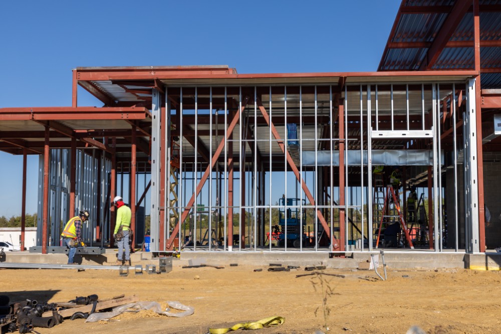 Workers building metal walls of Fire Station #2