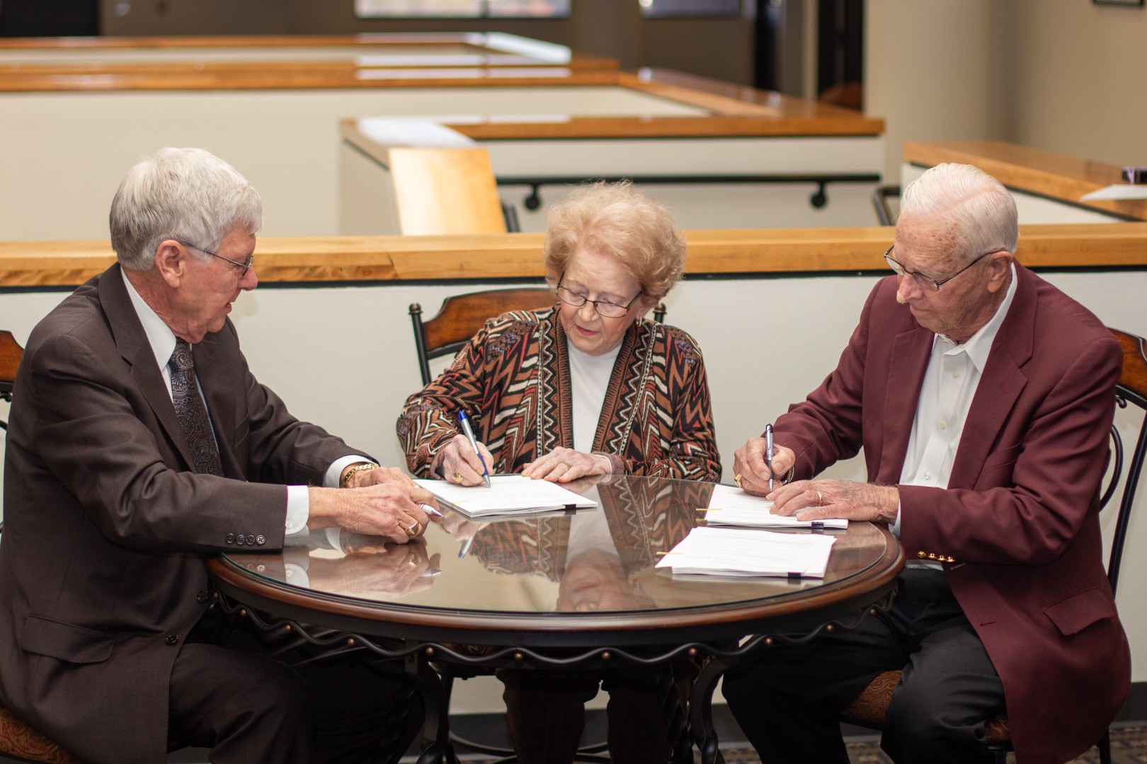 December 18, 2013 - Mayor Milton Tate, Evelyn Kruse, and Ed Kruse, sign documents for the land donation for Brenham Family Park