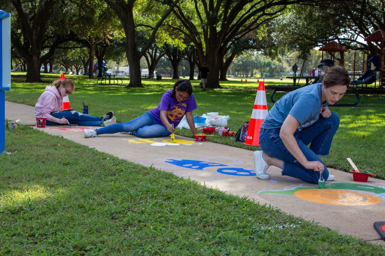 Born learning trail being painted by BISD volunteers in Jackson Street Park