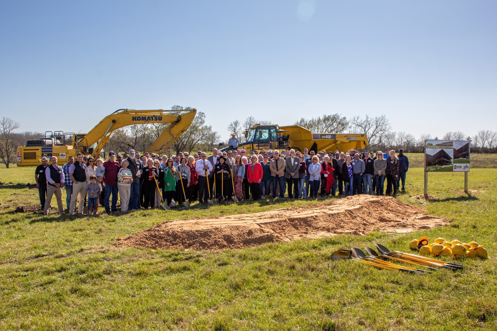 Corrosion Resistant Alloys groundbreaking - people in front of earth moving equipment